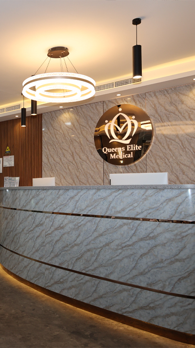 Queens Elite Medical Center clinic exterior and Dubai Marina waterfront promenade